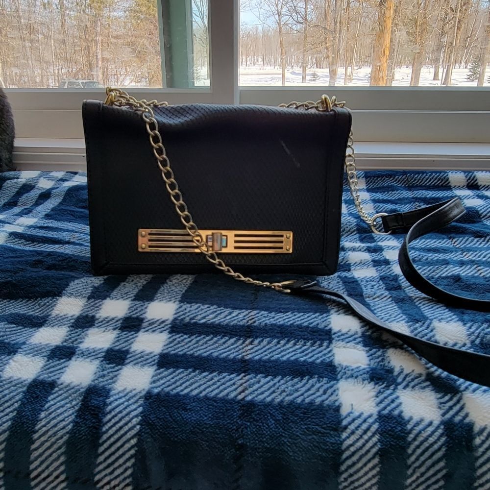 Black foldover and clasp purse